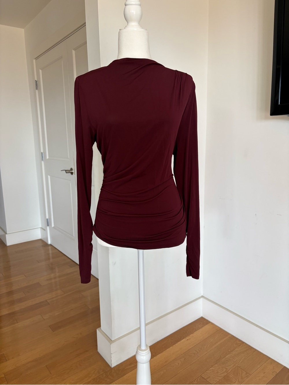 & Other Stories Long-sleeve top with mock neck and a gently draped finish.